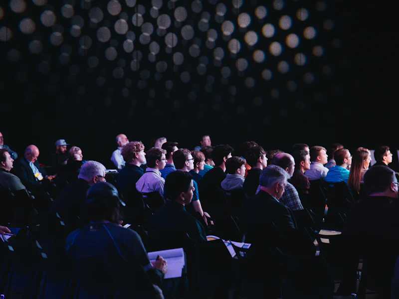 An audience seated for a company presentation