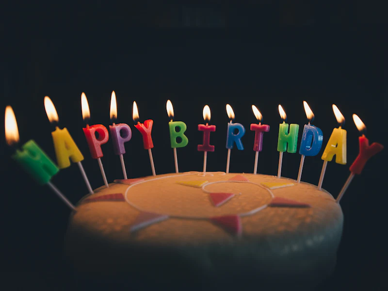 A birthday cake with letter candles